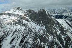 35 Cave Mountain With Old Goat Mountain Beyond From Helicopter Between Mount Assiniboine And Canmore In Winter.jpg